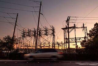 A car drives passed a power station in Mill Valley, California as a statewide blackout continues on October, 10, 2019.