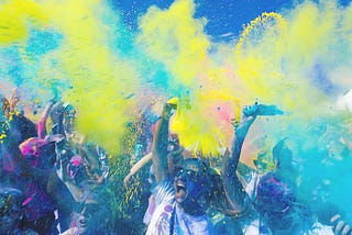 Photograph of people celebrating at a colourful event