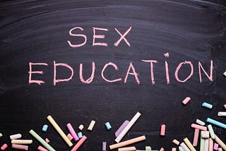 Chalkboard with words: “Sex education”