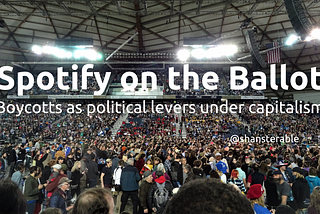 Spotify on the Ballot: Boycotts as political levers under capitalism. Image of a crowd at a political rally at the Tacoma Dome.