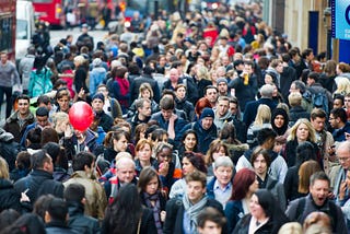Very crowded street with a large amount of people