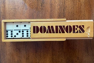 My childhood dominoes set, in its wooden box, with lid slightly open