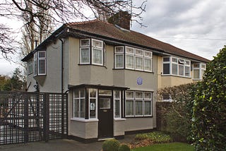 Waving from John Lennon’s Bedroom Window