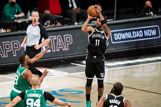 Brooklyn Nets star Kyrie Irving rises up for a jump shot against his former team, the Boston Celtics