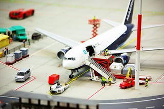 eco-friendly flying with a miniature-sized plane and airport scene