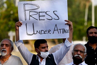 Pakistani journalists and activists at a demonstration called by the journalists union to condemn attacks on the media, in Islamabad, Pakistan, on May 28, 2021. © 2021 Anjum Naveed/AP Images