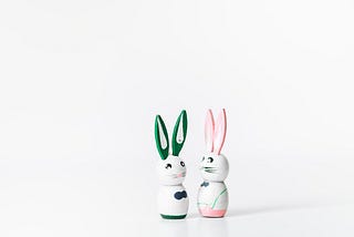 two rabbit figurines