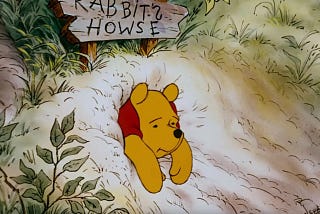 Winnie the Pooh gets stuck in Mr. Rabbits hole