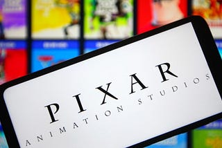 Tablet displaying Pixar Animation Studios over the backdrop of their movie covers