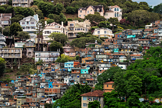 A composite picture of mansions on a hillside overlooking slums