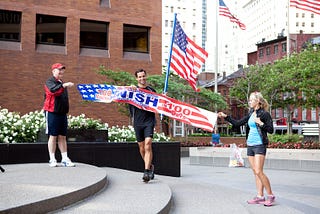 Croix Sather crossing the finish line of a 2,621 mile run across America