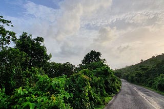 Open road, blue skies and the Western Ghats come alive in green