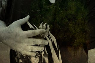 A stylised image of someone wearing a T-shirt and holding a hand over their heart.