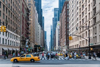 People crossing the street in a city