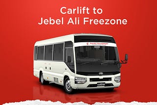 A white Toyota Coaster bus with the words “Carlift to Jebel Ali Freezone” written on the side. The bus is parked on a red background. There is also text on the side of the bus that says “Sans Transport”, “Private Passengers Transport” and “Call Now 050–8848270”.