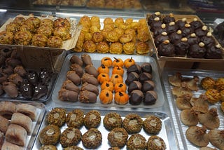 Panellets, small marzipan-like sweets, in a shop window in Catalunya