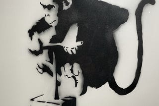 Graffiti of chimp detonating a bomb, by Bansky.