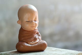 A Baby Buddha sitting peacefully in bliss.