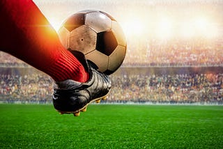 a foot kicking soccor ball