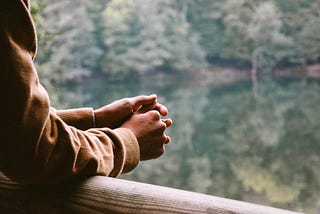 A person’s hands. Waiting on God.