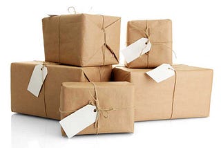 Collection of wrapped parcels with delivery tags.