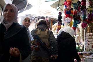 Moving through a market area in Damascus.