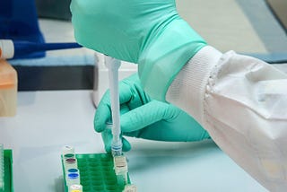 A lab scientist taking measured quantity of lab samples for analysis