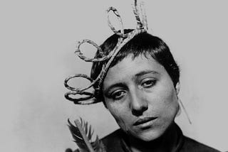 Still from The Passion of Joan of Arc. Joan looks despairing, dressed in a fake crown.