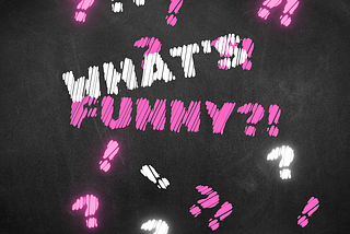 The What’s Funny?! logo. It’s Just letters with a smidge of silliness blended with statement-making. Pink-and-white whimsy on black chalkboard.