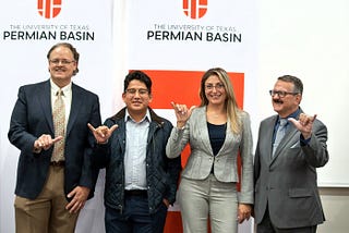 From left the following individuals smile for a photo: David Sparks, Co-Director, Math-Science Teacher Education, College of Education; Jesús Dimas, Chemistry Major, future UTeach Permian Basin student; Milka Montes, Co-Director, Chemistry Department Chair, College of Arts and Sciences; Larry Daniel, Dean, College of Education