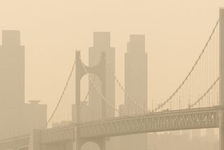 Gwangan Bridge and the city, a landmark in Busan, South Korea, are covered with contaminated yellow dust