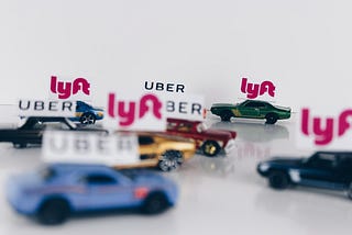 Uber and Lyft toy cars in a traffic jam