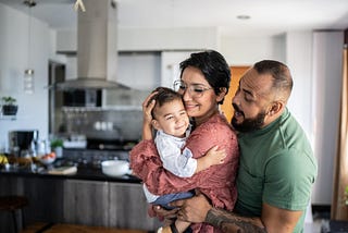 Family holding young child