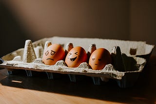 eggs with sad and happy expressions