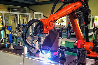 Automate MIG Welding operation in a Robotic cell.
