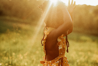 Little girl with the sunlight above