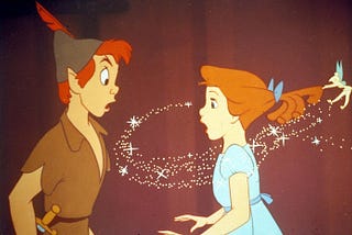 Peter Pan and Wendy from Disney’s Peter Pan. Tinker Bell is pulling Wendy’s hair.