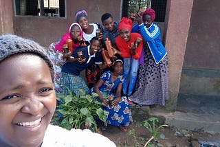 A group of young African women smiling