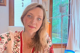 author blonde hair and red dress
