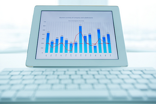 Image of a computer showing a graph of revenue data