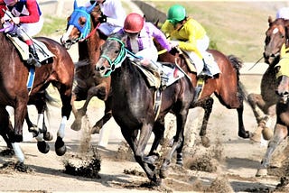 A horse race with several horses.