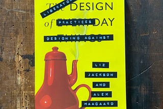 A softcover copy of the book The Design of Everyday Things, which has been altered with retro stick-on embossed letter strips, so the title now says, “Literatory Design Practices: Designing Against” and the authors now appear to be “Liz Jackson and Alex Haagaard”