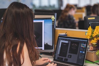 Person working in design software. Photo by Mimi Thian on Unsplash