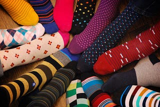 A circle of multi-colored, multi-patterned socks
