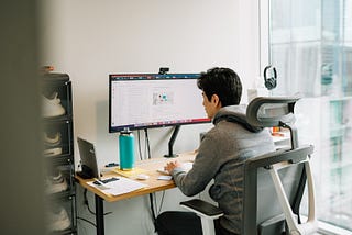 Dropbox employee working from desk at home.