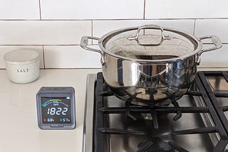 How much CO2 does a gas stove add to indoor air?