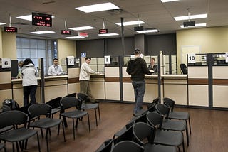 Passport office employees process peoples’ applications