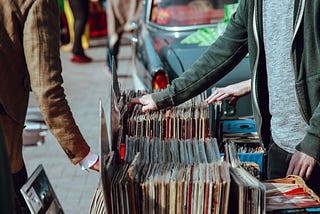 Few racks of records on street fair