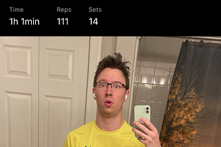 Screenshot of a post on the Hevy app. Bathroom mirror selfie of Colton looking worried about the next 330 days after his intense stretching workout.