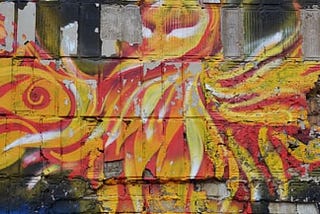 A wall mural of a flaming bird